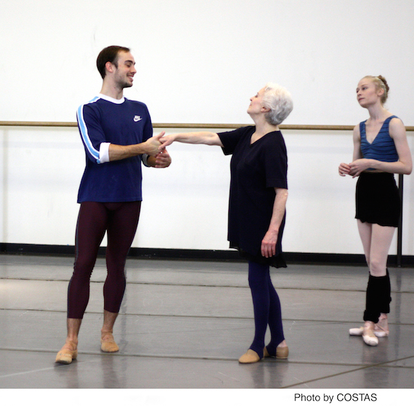 Tyler Angle takes Violette Verdy's outstretched hand as NYCB dancer Janie Taylor observes.